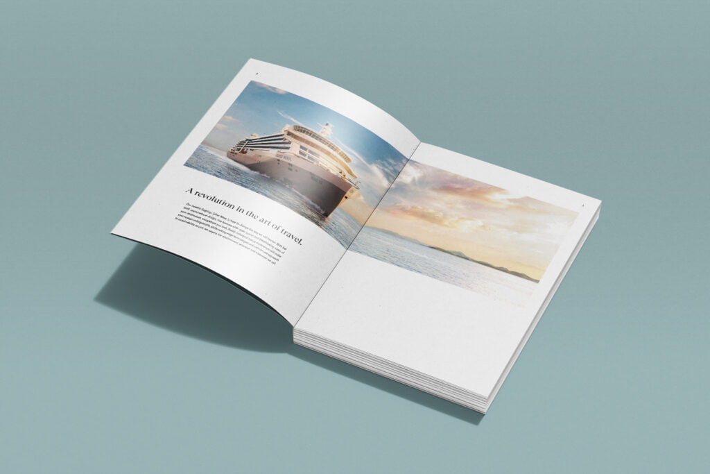 Open magazine on a teal surface showcasing creative direction—a large cruise ship at sea on the left page and a sunset over the ocean on the right, with minimal text beside the ship image. - FelipeIgiesias.com