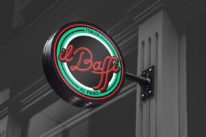 Felipe Iglesias Home 12 A round, illuminated sign for il Baffi spotlights stylish branding with red cursive text, green and red rings, plus ITALIA and AL PASO—all set against a dark, urban background for maximum visual impact. - FelipeIgiesias.com