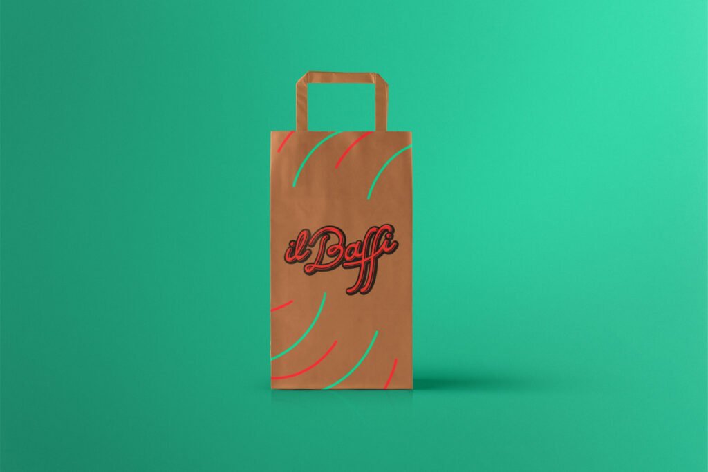 A brown paper bag with handles, decorated with red and teal curved lines and the text il Baffi in bold script, showcases creative direction in design against a bright turquoise background. - FelipeIgiesias.com